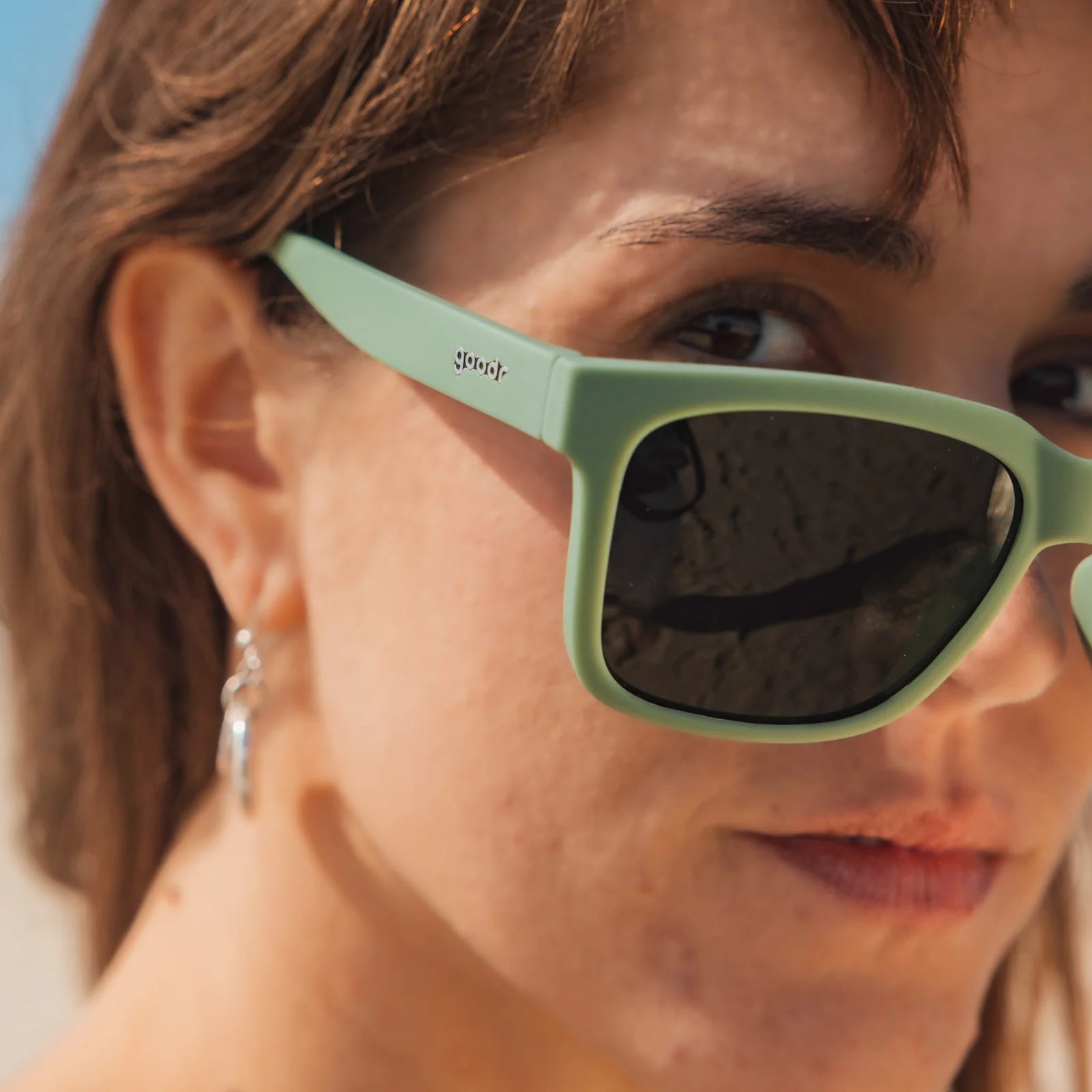 Dark green polarised sunglasses with non-reflective lenses. Water repellent and capable of floating.